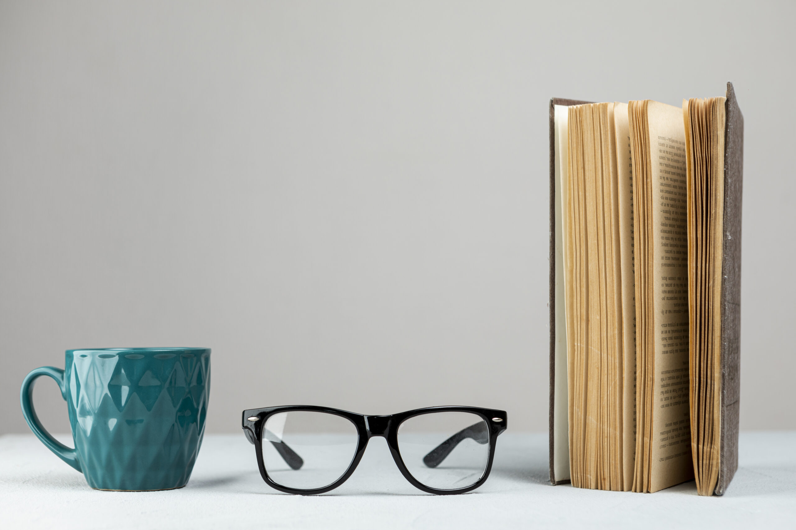 front-view-standing-book-with-glasses